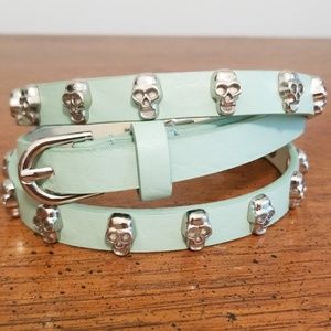 Mint belt with decorative silver scull studs.